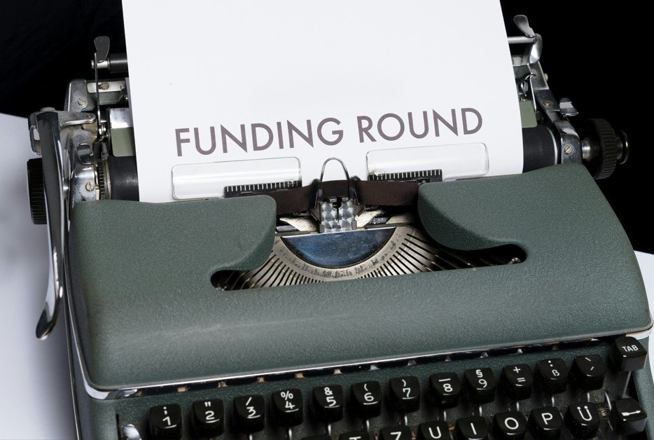 A Typwriter with a piece of paper in it that reads %22Funding Round%22. Credit: Markus Winkler, Unsplash.