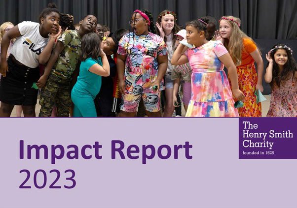 The image shows a group of children posing together, seemingly in a playful or expressive manner. They are wearing colorful clothing and appear to be having fun. Below the photo, there is a purple banner with text that reads Impact Report 2023